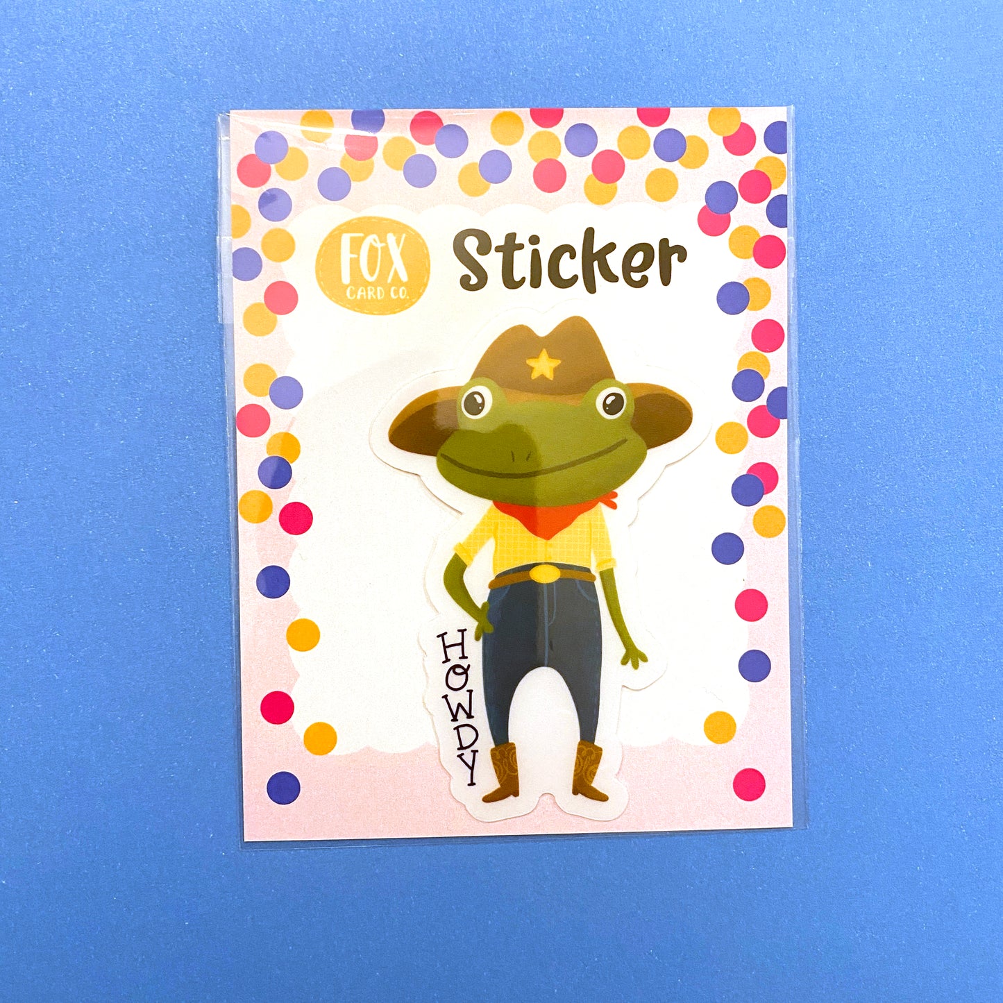 Transparent vinyl sticker featuring an adorable cowboy frog. HOWDY! Oringial design by Anna Fox. Waterproof, Dishwasher safe and scratchproof sticker that is made to last!