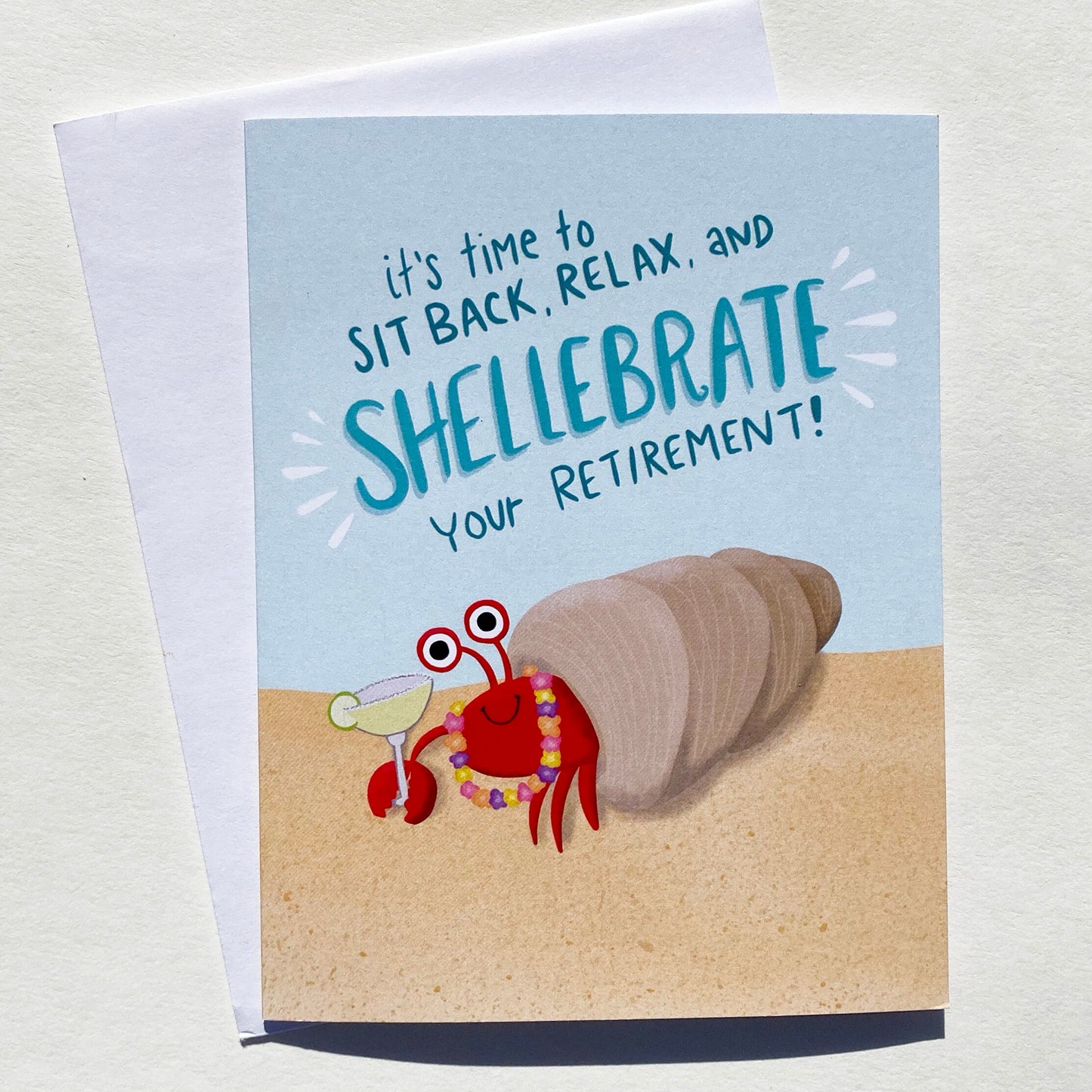 Tropical Retirement Card with a crab holding a margarita that says "it's time to site back, relax and shellebrate your retirement!