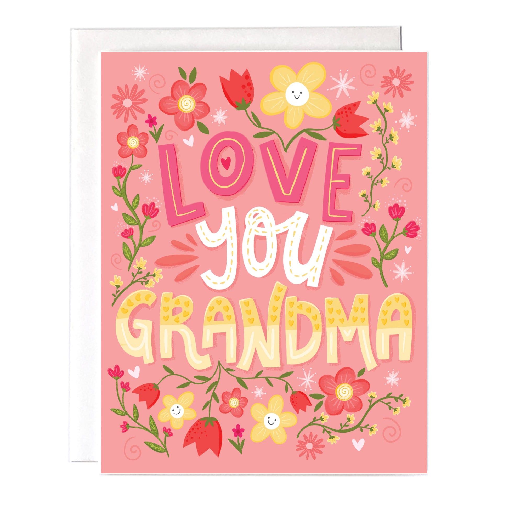 A pink card with yellow, white and pink flowers that says “love you grandma”. Size a2 greeting card, blank inside with white envelope.