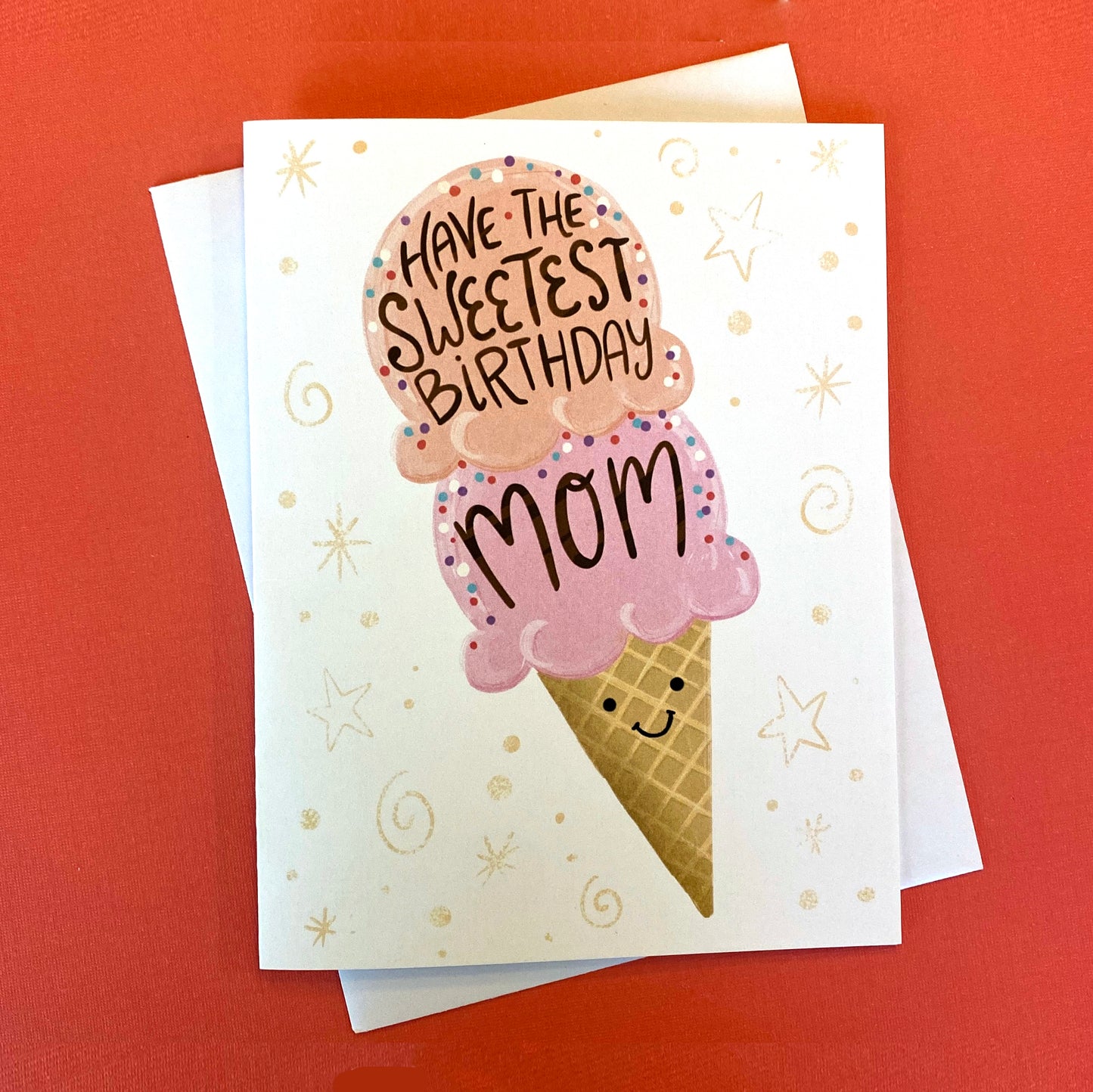 A birthday card for mom that has an ice cream cone on it and it says "have the sweetest birthday mom".