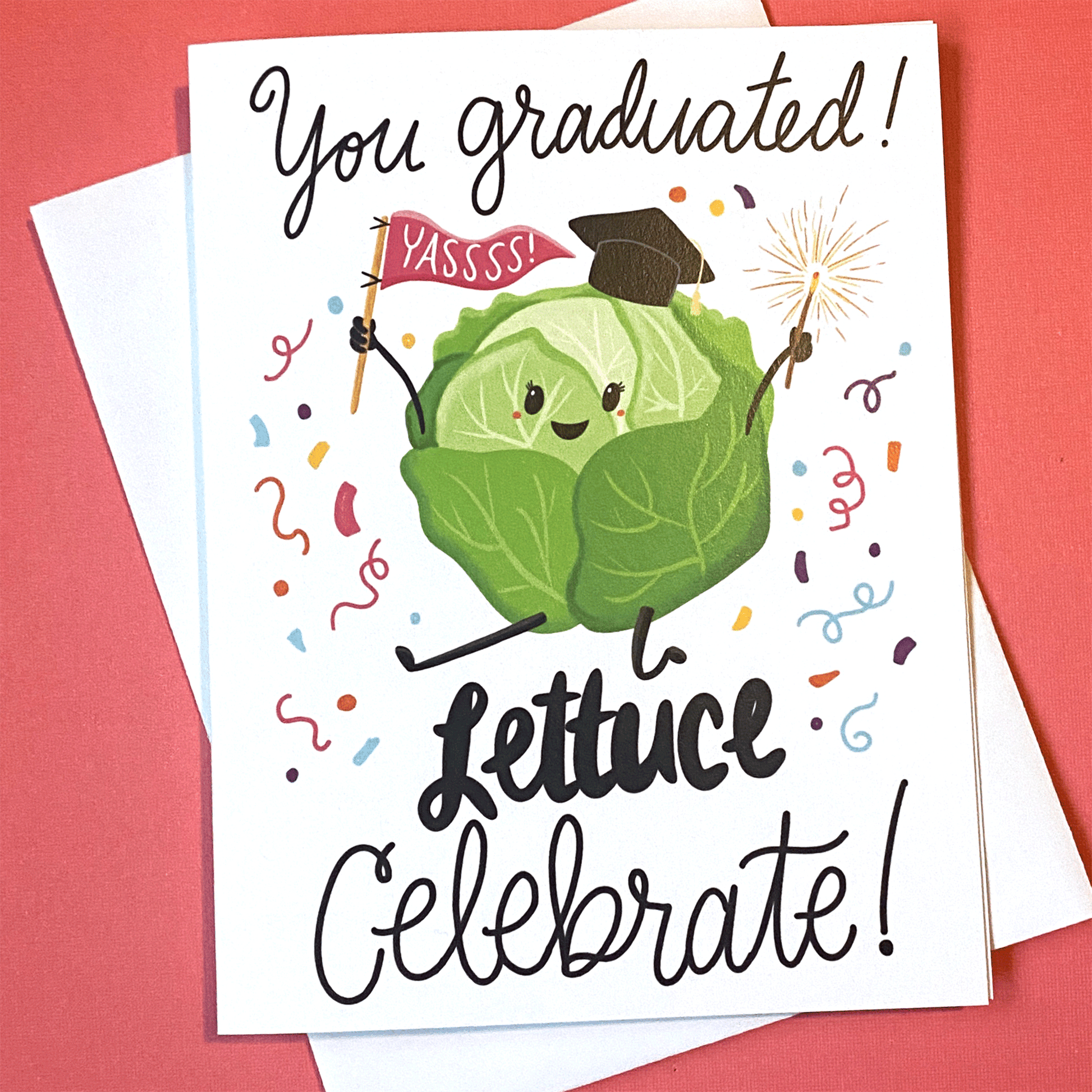 the card reads you graduated lettuce celebrate. There is a head of lettuce wearing a grad hat