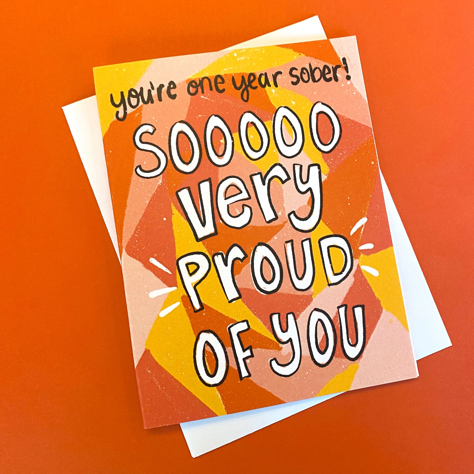 greeting card for someone's one year sober birthday. the cards says "you're one year sober! Soooo very proud of you"